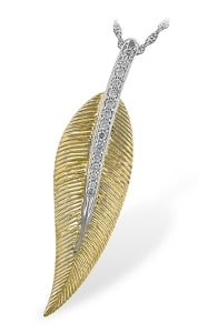 This pendant from Allison-Kaufman features mixed metal designs with an array of diamonds