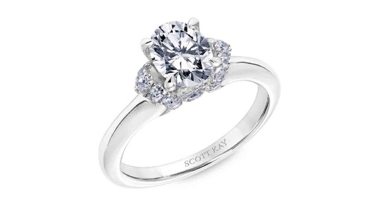 A silver engagement ring from Scott Kay featuring an oval cut center stone