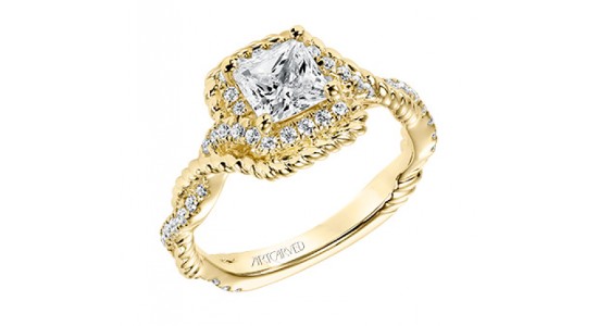 A yellow gold engagement ring with intertwining bands, side stones, a halo, and princess cut center stone