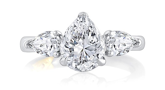 A white gold three stone engagement ring featuring three pear shaped diamonds