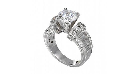 an elaborately designed white gold engagement ring