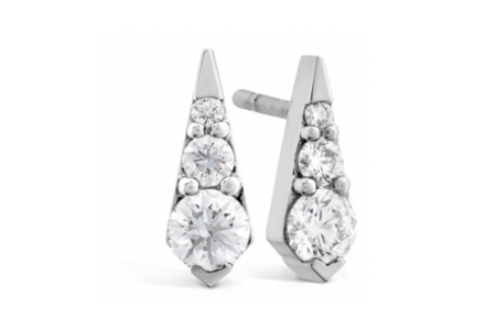 A close-up of a distinctive pair of Hearts on Fire stud earrings, available at Rogers Jewelry Co.