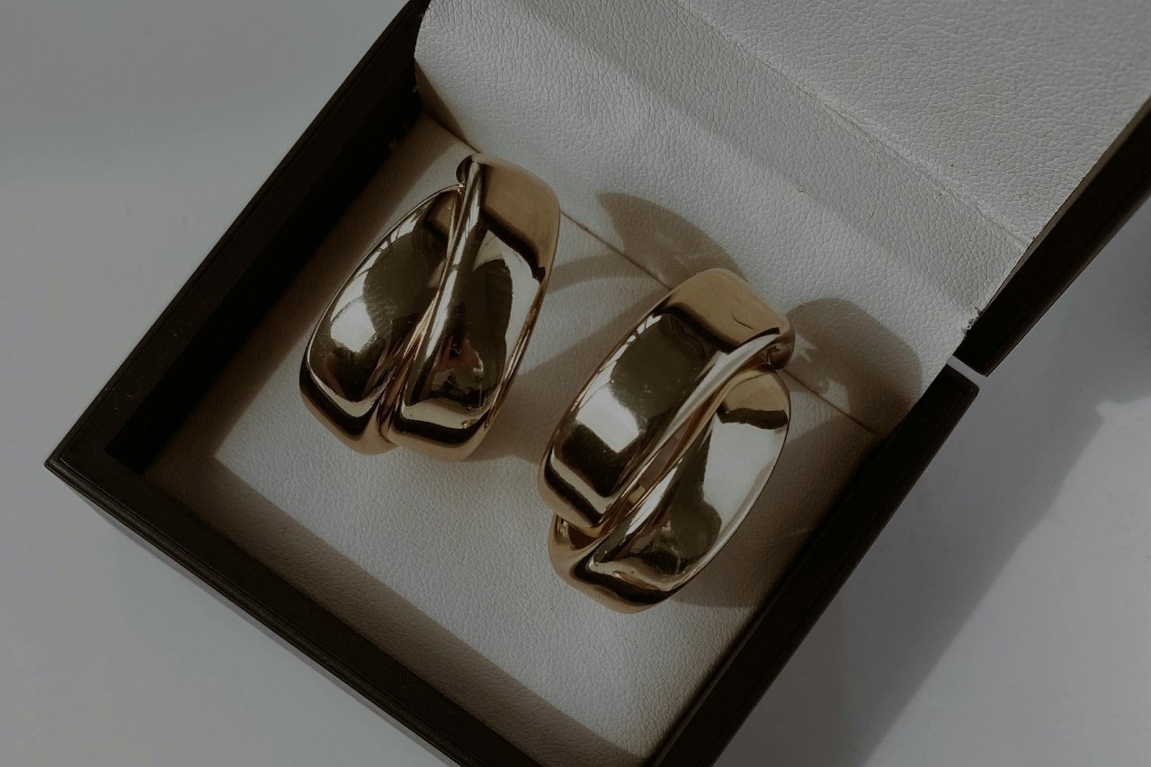 a pair of silver hoop earrings in a jewelry gift box