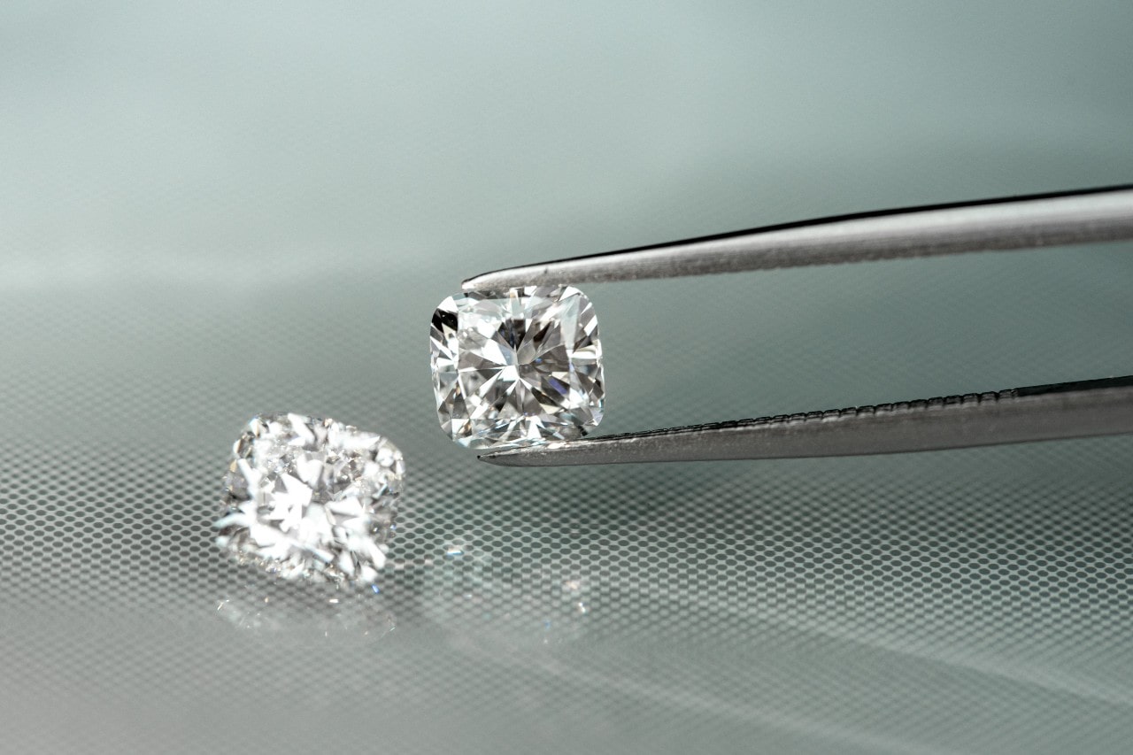 loose diamonds on display on mirrored table