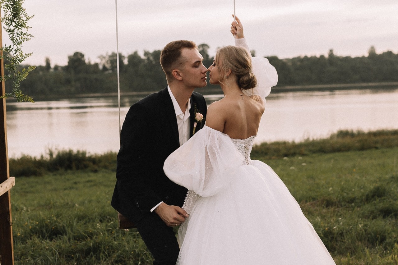 couple kissing under an umbrella